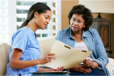 Nurse showing a document to a senior