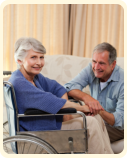 woman in wheelchair with her husband