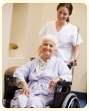 old woman in wheelchair with her caregiver