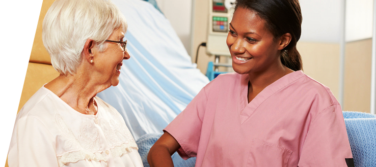Elderly woman with her caregiver