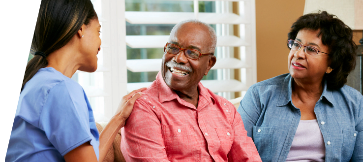 Elderly couples talking with their caregiver